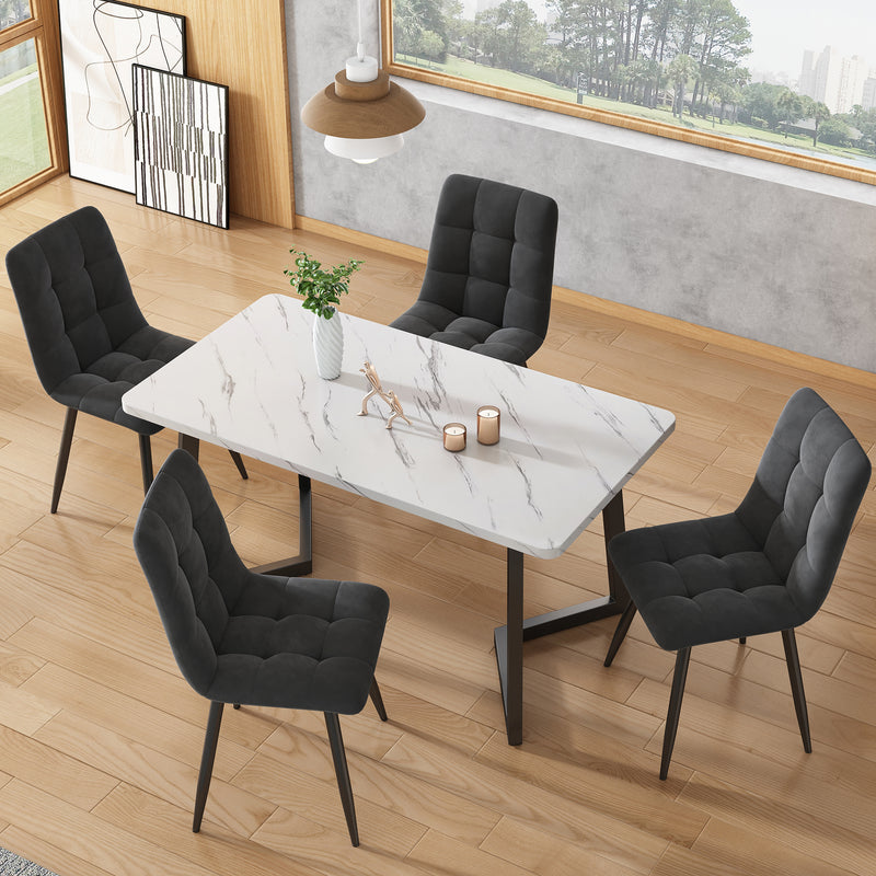Table de salle à manger moderne avec plateau effet marbre et pieds en métal noir GILQELS